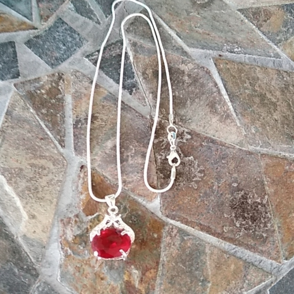 Pretty red charm with silver chain.